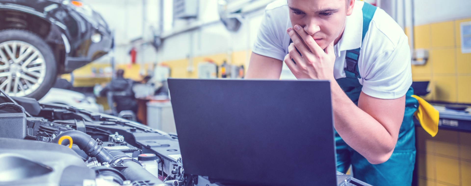 Mechanic doing a diagnostics plugin - Car Diagnostics Huddersfield